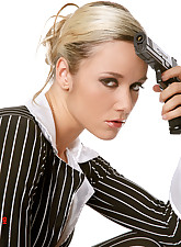 Blond Jana playing with a gun