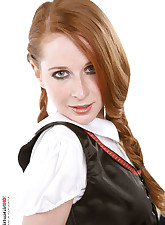 Redhaired beauty gets rid off a bavarian costume